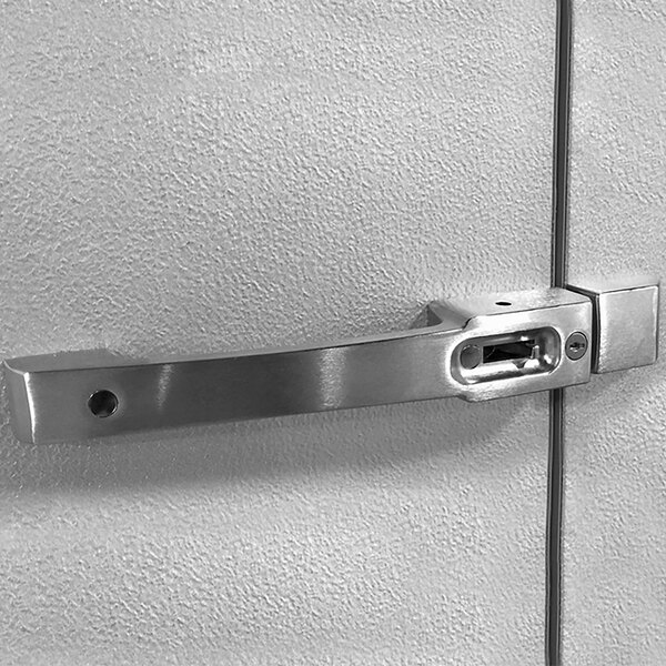 A stainless steel door handle on a white wall.