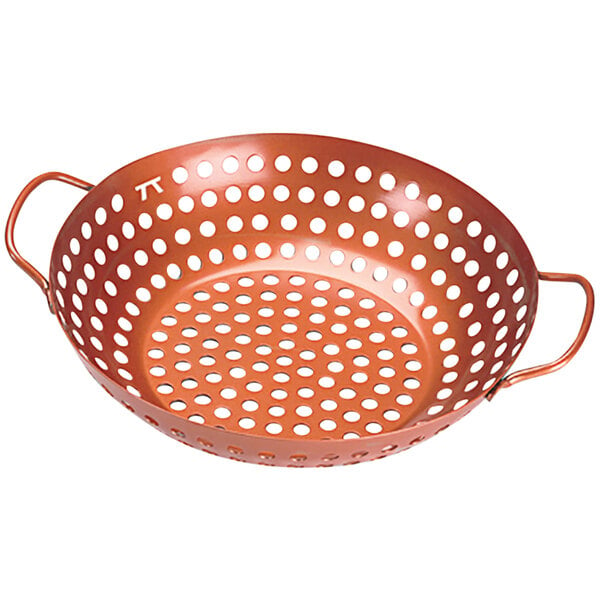 An Outset copper grill basket with holes in it.