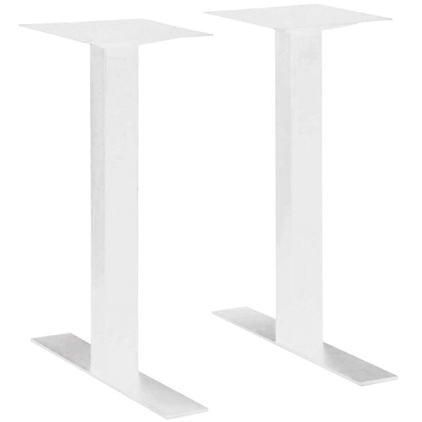 A pair of white metal rectangular column table bases.