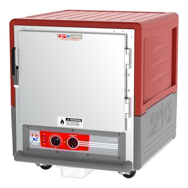 A red and grey Metro C5 3 Series heated holding cabinet with a white door and wheels.