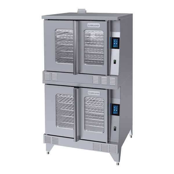 A large commercial Garland electric convection oven with two open doors and shelves inside.