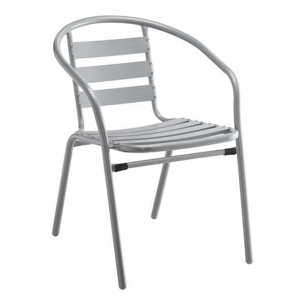 A gray metal arm chair with a white seat.