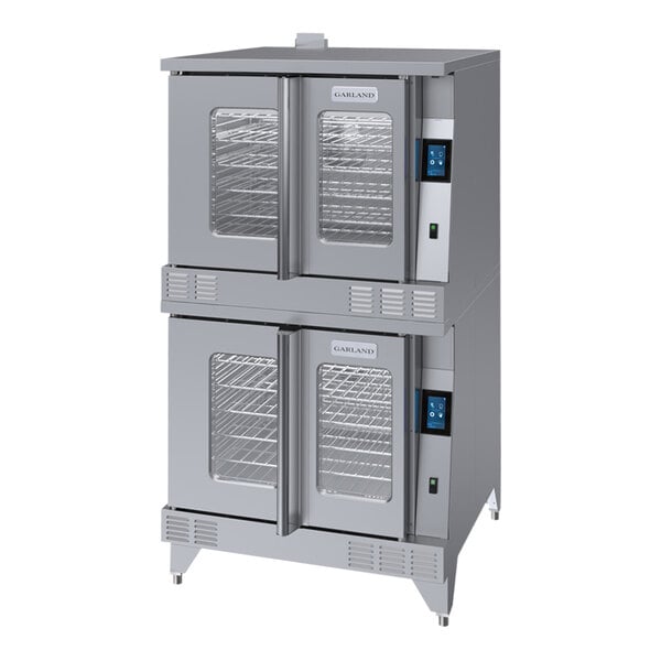 A large stainless steel commercial Garland double deck convection oven with glass doors.