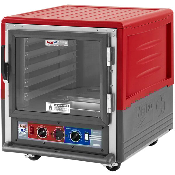 A red and grey Metro C5 heated holding and proofing cabinet with a clear glass door and lip load slides.