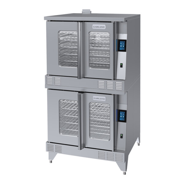 A large Garland commercial convection oven with two open doors and shelves inside.