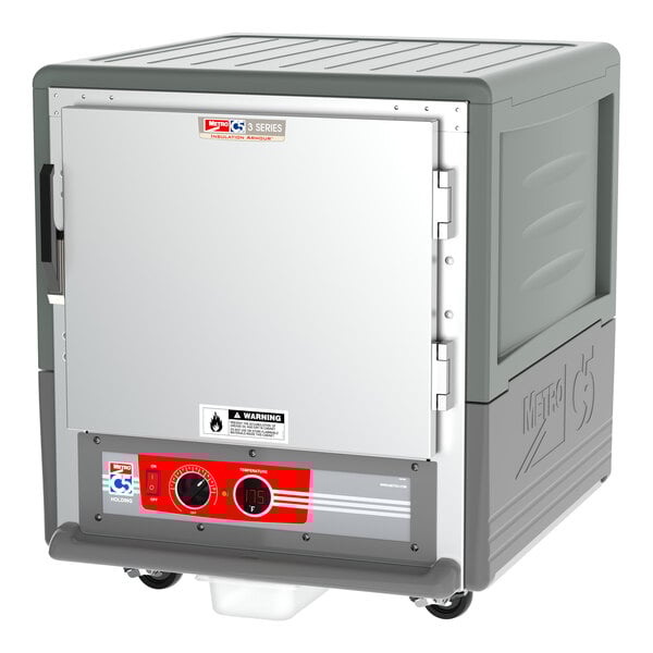 A grey Metro C5 3 Series holding cabinet with a solid door and red and white label.