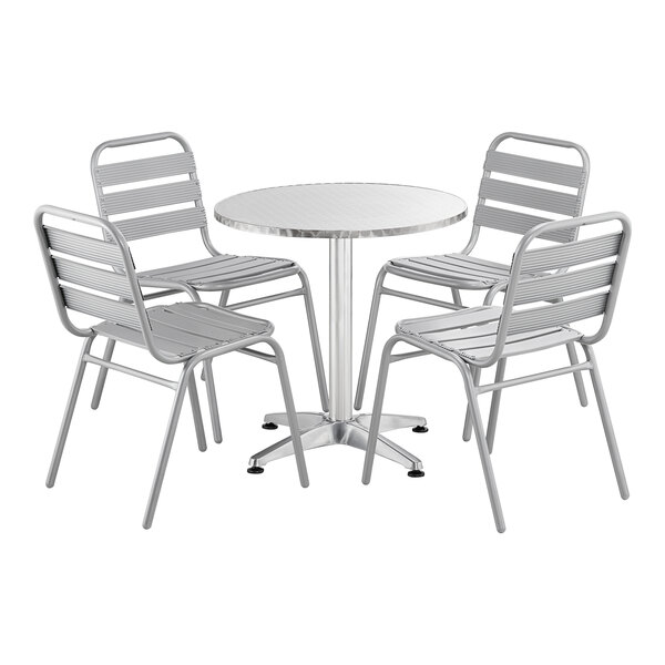 A Lancaster Table & Seating chrome table with 4 chairs around it.