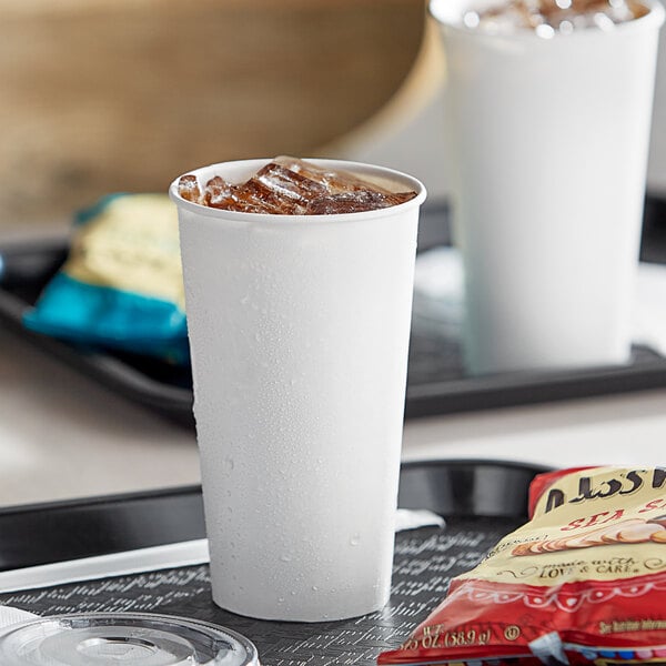 A tray with two white Choice paper cold cups filled with ice.