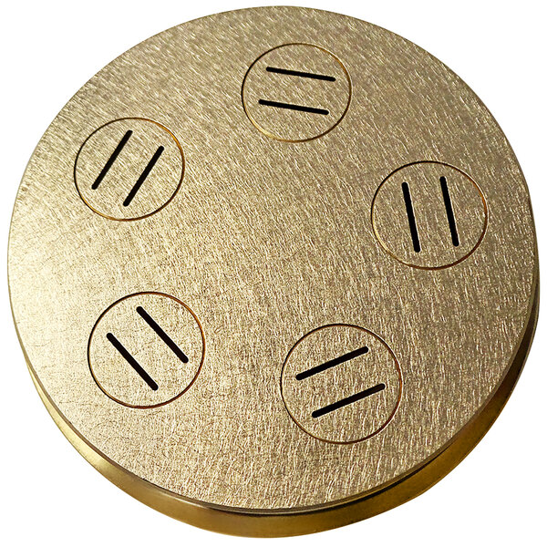 a circular gold object with holes in it