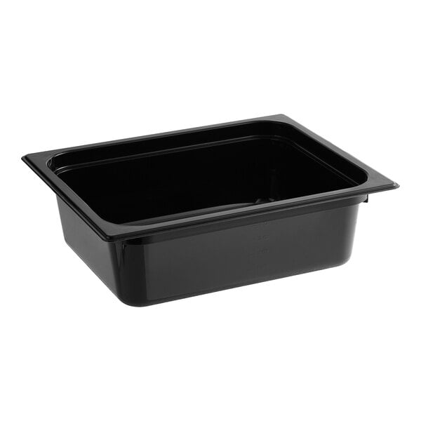 A Carlisle black polycarbonate food pan on a counter.