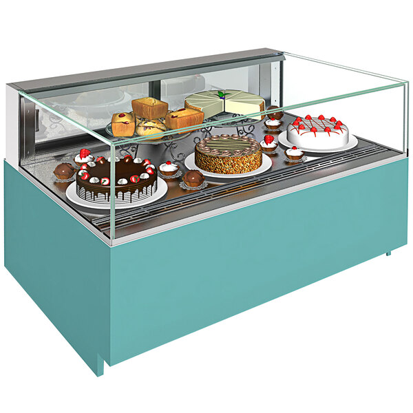 A Structural Concepts refrigerated bakery display case on a counter with cakes and desserts inside.
