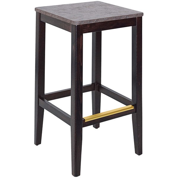 a stool with a gold bar