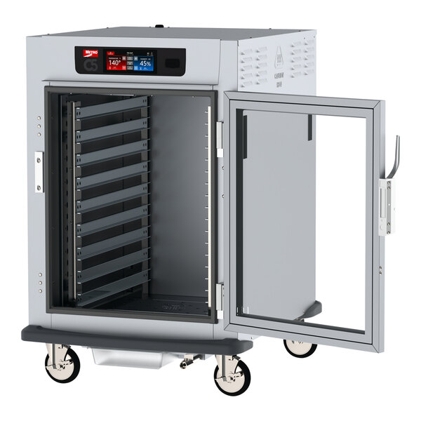 A large white Metro holding cabinet with a clear door open.