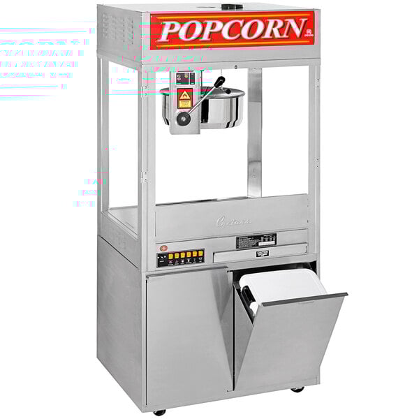 A Cretors floor model popcorn machine with a bucket and a lid.