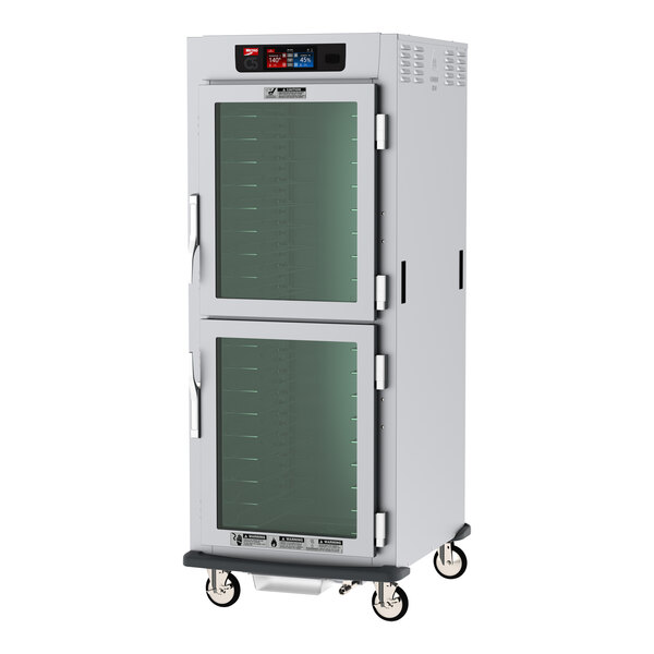 A Metro C5 9 Series holding cabinet with clear Dutch doors.