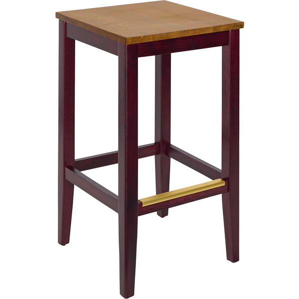 A BFM Seating dark mahogany wood backless barstool with an autumn ash seat.