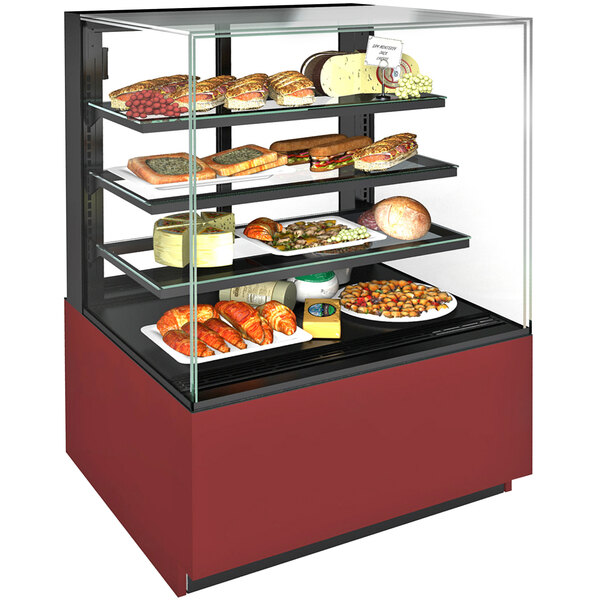 A Structural Concepts Reveal refrigerated bakery display case with food on it.