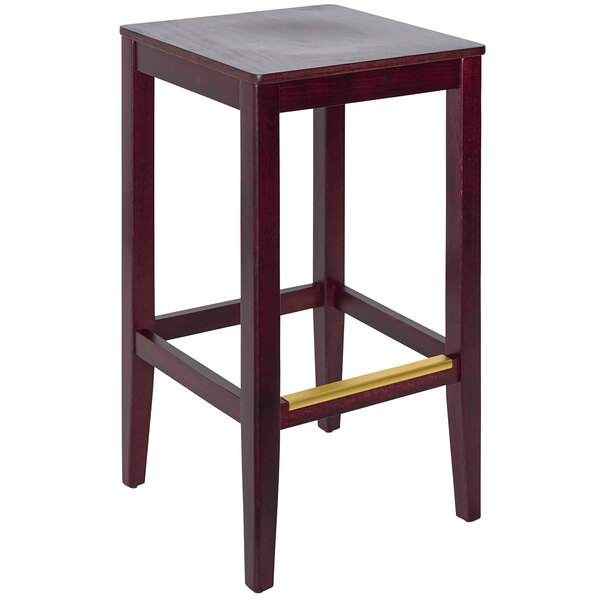 A BFM Seating dark mahogany wood barstool with a veneer seat.