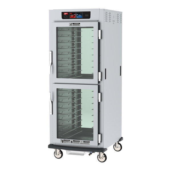 A Metro C5 full size insulated holding cabinet with clear Dutch doors.