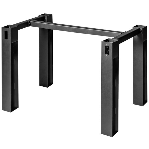 a black metal table with four legs