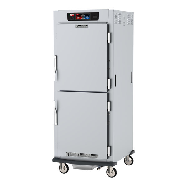 A white metal Metro C5 holding cabinet with two doors.