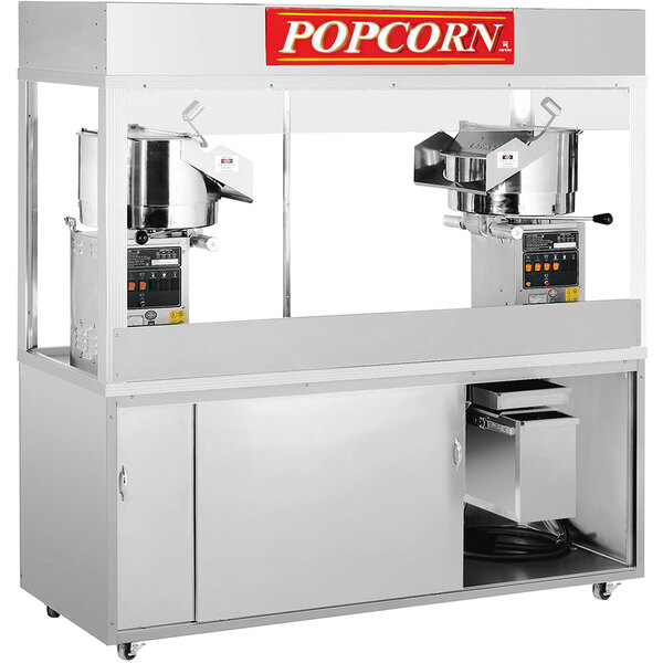 A Cretors floor model popcorn popper with two kettles, one larger than the other.