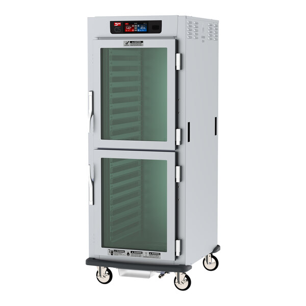 A Metro C5 holding cabinet with clear glass Dutch doors.