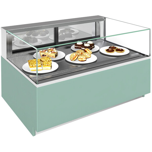 A Structural Concepts Reveal non-refrigerated bakery display case with plates of pastries.