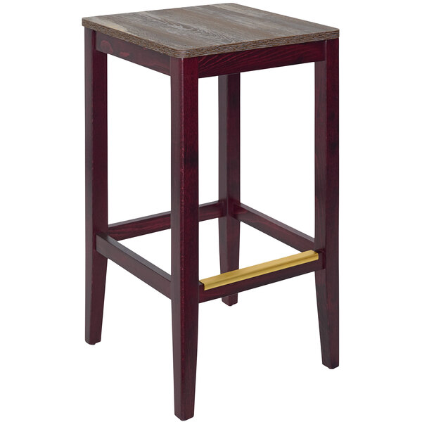 A BFM Seating dark mahogany beechwood barstool with a wooden top.