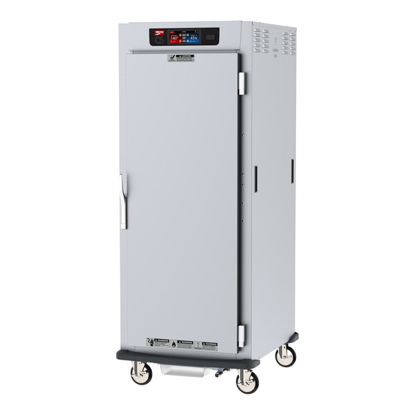 A white Metro C5 holding cabinet with a stainless steel door and wheels.