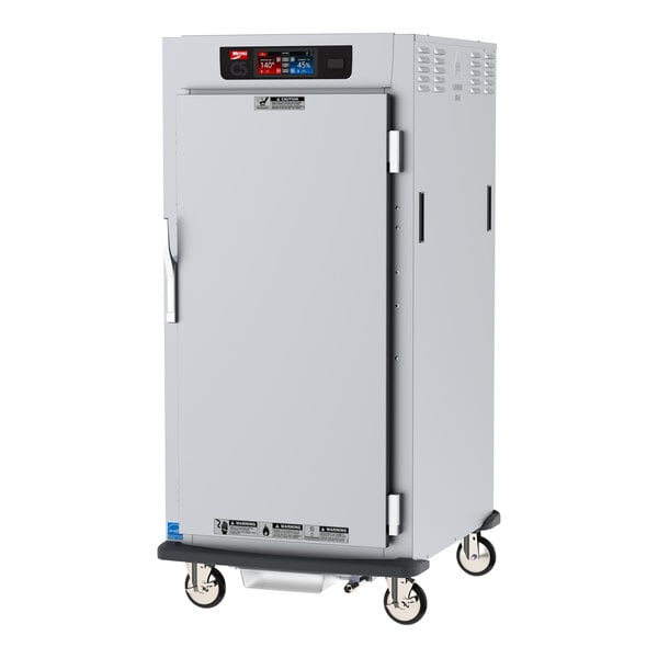 A white Metro C5 holding cabinet with a solid door open.