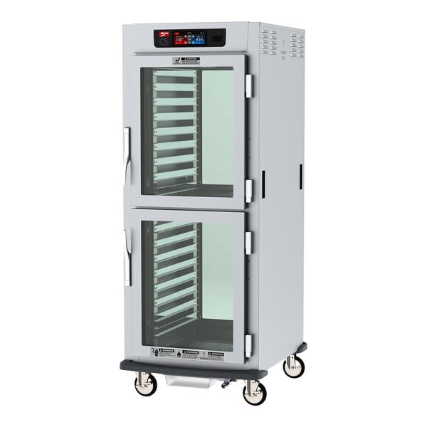 A Metro C5 low wattage holding cabinet with clear Dutch doors and chrome slides.