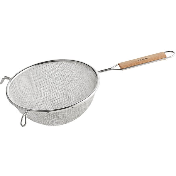 A Vollrath stainless steel double mesh strainer with a wood handle.