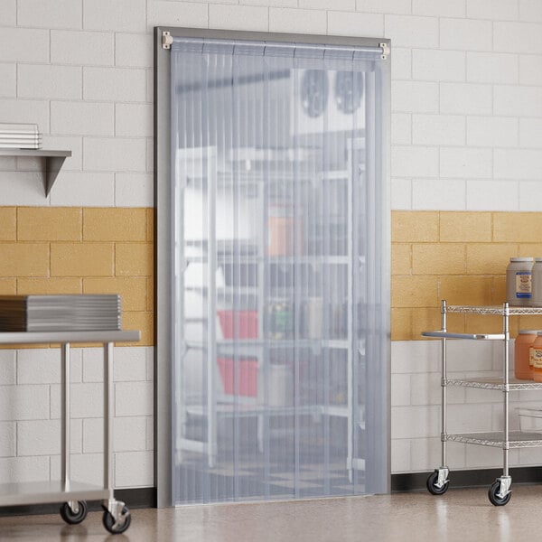 A kitchen with a Curtron Polar reinforced strip door.