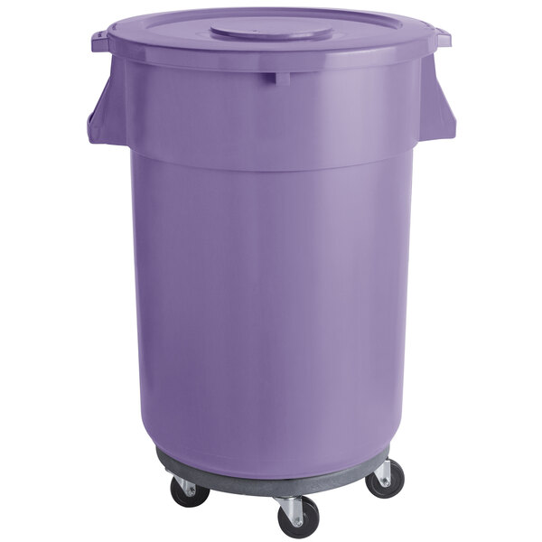 A purple plastic trash can on wheels.