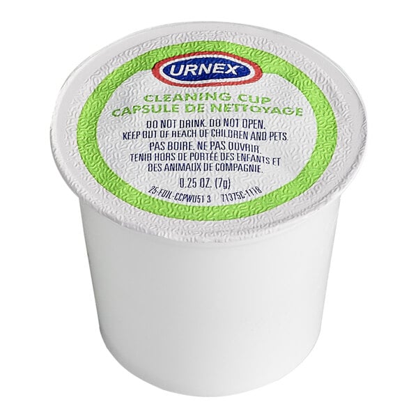 A single-use Urnex cleaning cup designed for K-Cup coffee brewers.