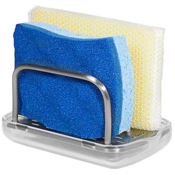 A stainless steel OXO sponge holder with blue sponges in it.