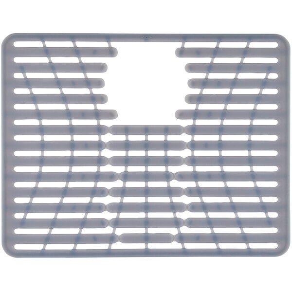 A white plastic sink mat with a grid of holes.