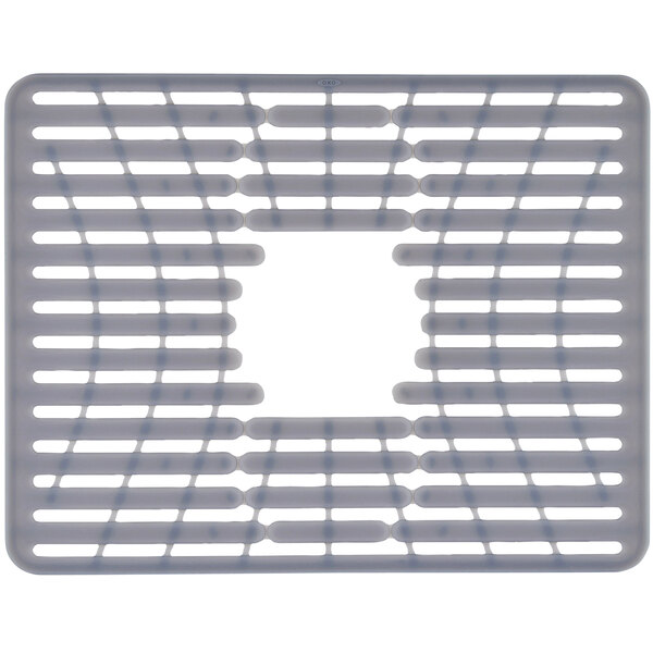 A gray silicone sink mat with holes in it.