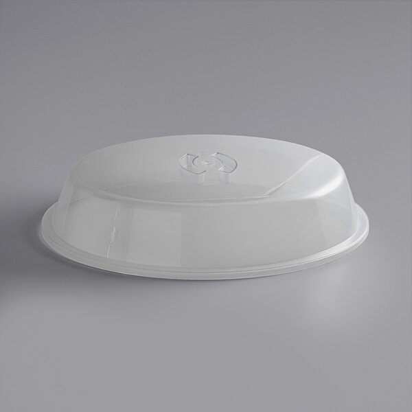 An American Metalcraft clear plastic oval tray cover on a white surface.