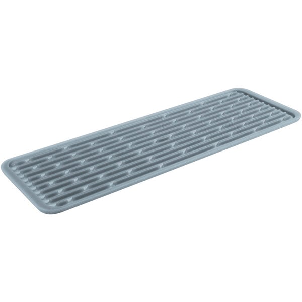 An OXO Good Grips grey rectangular silicone drying mat with a grid pattern and a grey plastic strip with holes.