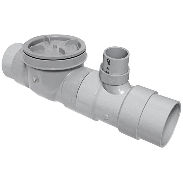 A grey pipe with a round cap and a valve.