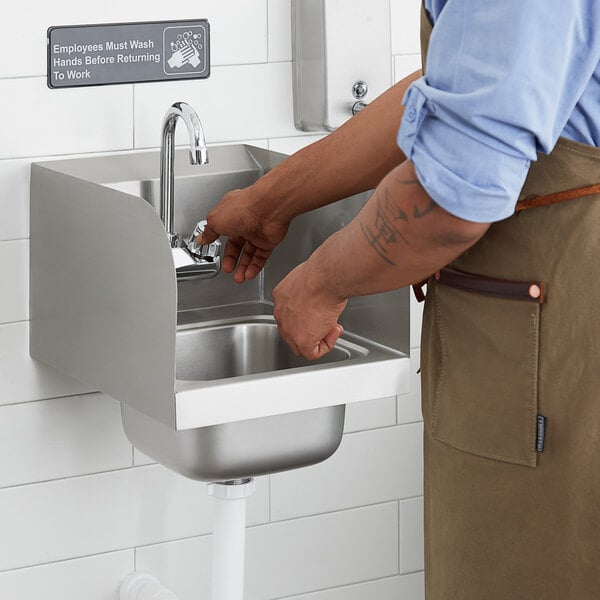 a person's hands in a sink