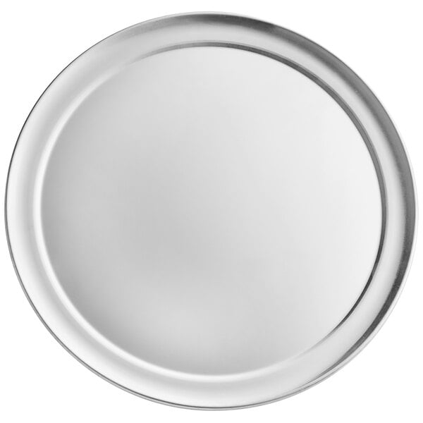 A silver pizza pan with a wide rim.