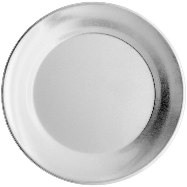 A white plate with a silver rim.