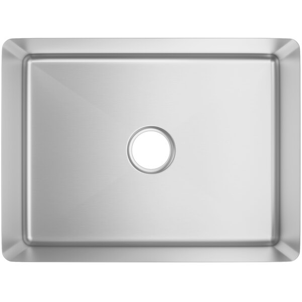 A close-up of a stainless steel Regency undermount sink bowl with a hole in the center.