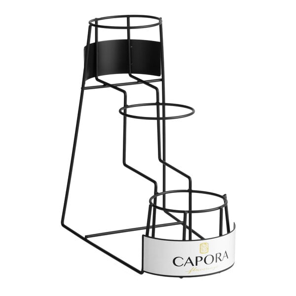 A three-tier metal rack designed to hold 64 oz. flavoring sauce bottles, branded with 'Capora' on the front.