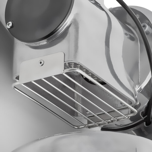 An Estella electric hard cheese grater with a metal basket.