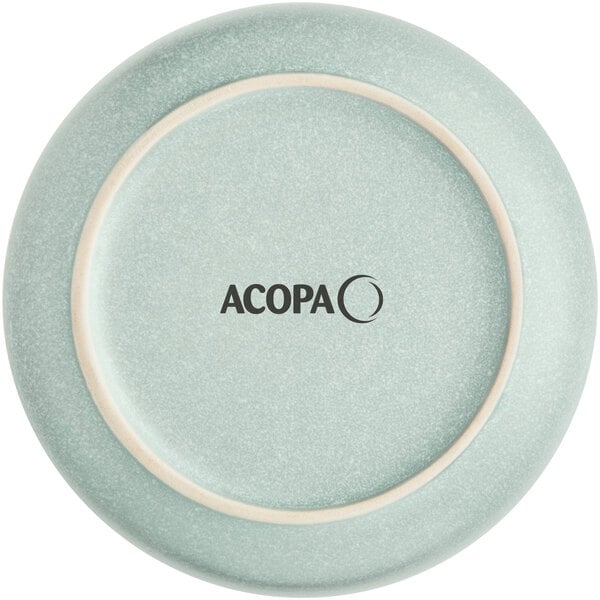 An Acopa Pangea Harbor Blue porcelain saucer with a close up of the plate.