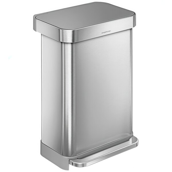 A simplehuman stainless steel rectangular step-on trash can with a lid.